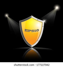 vector  shield with metallic border and lights over black background. Eps10