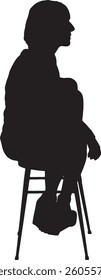 vector; silhouette of back view of a woman sitting on chiar looking away