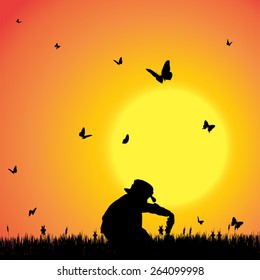 Vector silhouette of a boy with butterflies.