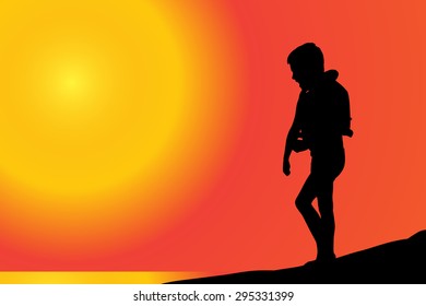 Vector silhouette of boy on a beach at sunset.