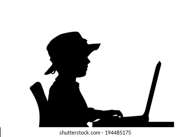 Vector silhouette of a boy sitting at a computer on a white background.