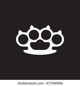 A vector silhouette of brass knuckles on a black background.