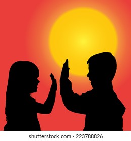 Vector silhouette of a children at sunset.