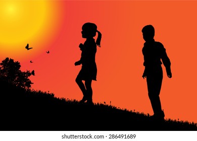 Vector silhouette of a children at sunset.