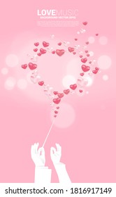 Vector silhouette of conductor hand hold baton stick with heart balloon flying . Concept background for love song and concert theme.