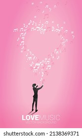 Vector silhouette of conductor with heart music note flying . Concept background for love song and concert theme.