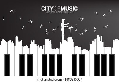 Vector silhouette of conductor with piano key shaped the the big city outline silhouette. Background concept for classic song event and music festival