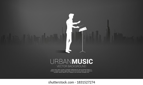 Vector silhouette of conductor standing with city background. Concept for city of music.
