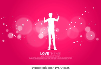 Vector silhouette of conductor standing with heart paper art flying . Concept background for love song and concert theme.