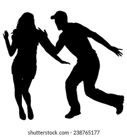 Vector silhouette of couple dancing on a white background.