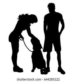 Vector silhouette of couple with dog on white background.