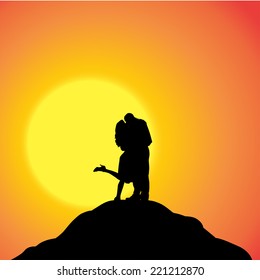 Vector silhouette of couple on a hill at sunset.