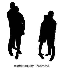 Vector silhouette of couple, standing, black color, isolated on white background