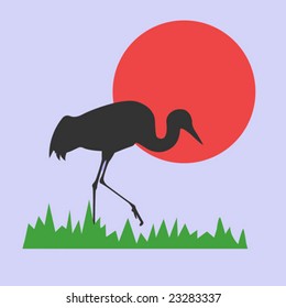 vector silhouette of the crane on background red sun