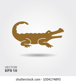 Vector silhouette of a crocodile. Flat icon with a shadow