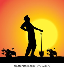Vector silhouette of a gardener in the garden at sunset.