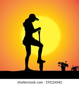 Vector silhouette of a gardener in the garden at sunset.