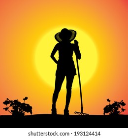 Vector silhouette of a gardener in the garden at sunset.