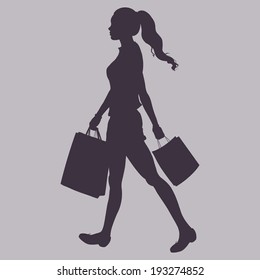Vector Silhouette - girl goes and is in the hands of shopping bags