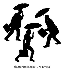 Vector silhouette of group of people with umbrellas.