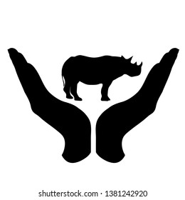 Vector silhouette of a hand in a defensive gesture protecting a rhinoceros. Symbol of animal, wild,africa, nature, humanity, care, protection, veterinary.