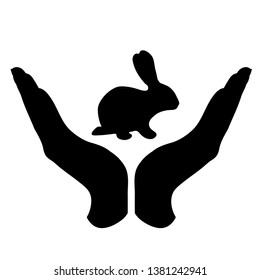 Vector silhouette of a hand in a defensive gesture protecting a rabbit. Symbol of animal, farm,hare, humanity, care, protection, veterinary.
