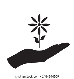 Vector silhouette of a hand in a defensive gesture protecting a flower. Symbol of plant,agriculture,protection,fresh,park, nature.