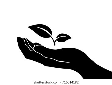 A vector silhouette of a hand holding a seedling. Love farming and nature.
