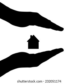 Vector silhouette of a hands with house on a white background.