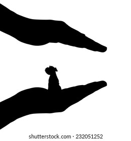 Vector silhouette of hands to protect the dog.