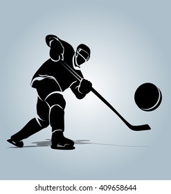 Vector silhouette of a hockey player with puck