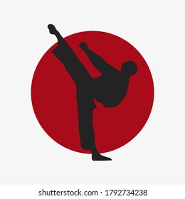 An vector silhouette of karate kick. Martial art vector illustration. Japanese rising sun.