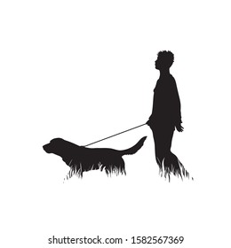 Vector silhouette of man with dog in the grass on white background. Symbol of boy, people, animal, pet, training, nature, park, garden.