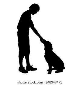Vector silhouette of a man with a dog on a white background.