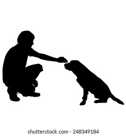 Vector silhouette of a man with a dog on a white background.