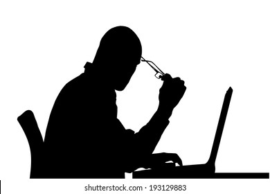 Vector silhouette of a man sitting at a computer on a white background.
