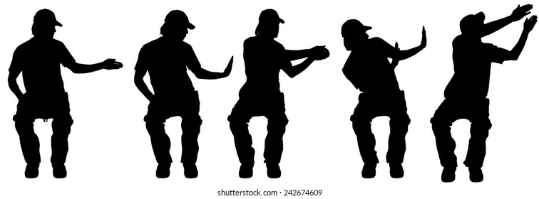 Vector silhouette of a man sitting on a white background.