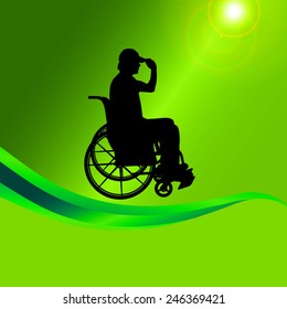 Vector silhouette of a man in a wheelchair on a green background.