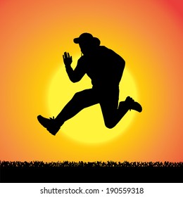 Vector silhouette of man who jump at sunset.