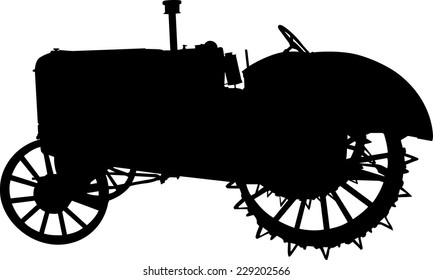 Vector silhouette of old tractor of road