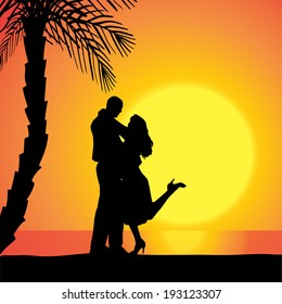 Vector silhouette of people on a beach at sunset.