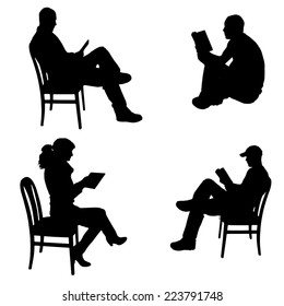 Vector silhouette of people who read on a white background.