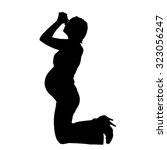 Vector silhouette of a pregnant woman on a white background.