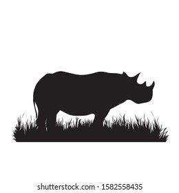 Vector silhouette of rhinoceros in the grass on white background. Symbol of animal, zoo, Africa, safari, wild, nature, park, garden.