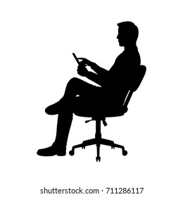 Vector silhouette of a sitting businessman on chair. Isolated vector on  white background.