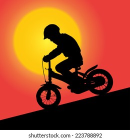 Vector silhouette of a small boy at sunset.