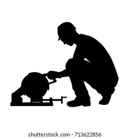 Vector silhouette of a technician with electric grinding metal. Isolated vector on white background.