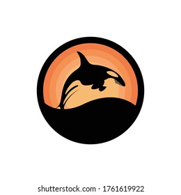 Vector Silhouette Of A Whale Jumping To Sea Level At Sunset