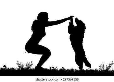 Vector silhouette of a woman with a dog on a meadow.