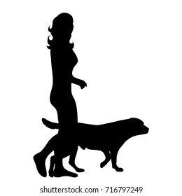 Vector silhouette of woman with dog in white background.